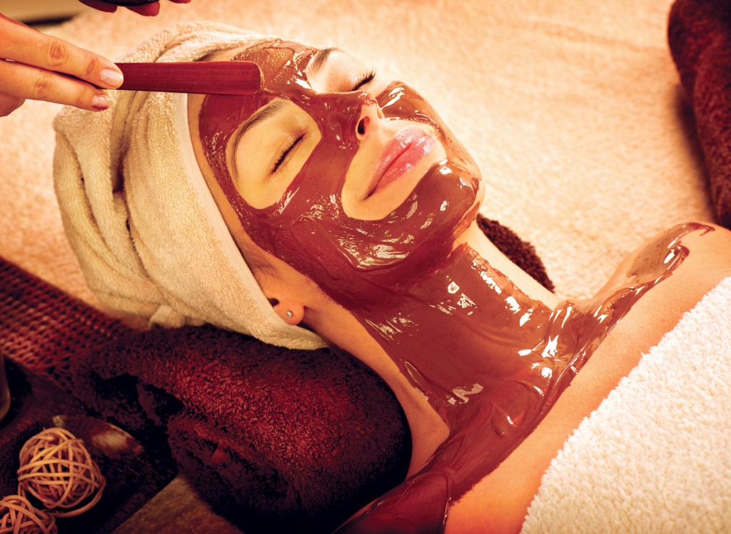 Chocolate Luxury Spa. Facial Mask. Spa therapy for young woman w